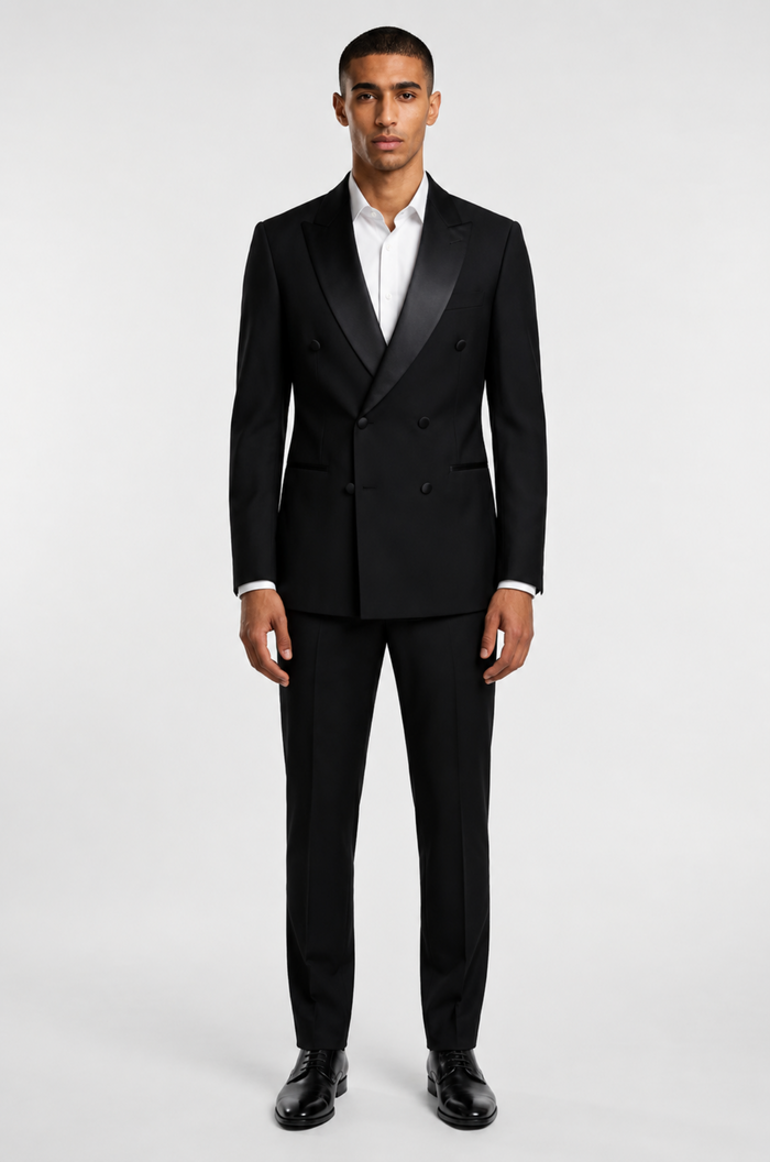 Blutailor black broad lapel double-breasted tuxedo in premium fabric with a custom tailored fit, featuring a sharp structured silhouette and elegant detailing for a bold, sophisticated formal look.