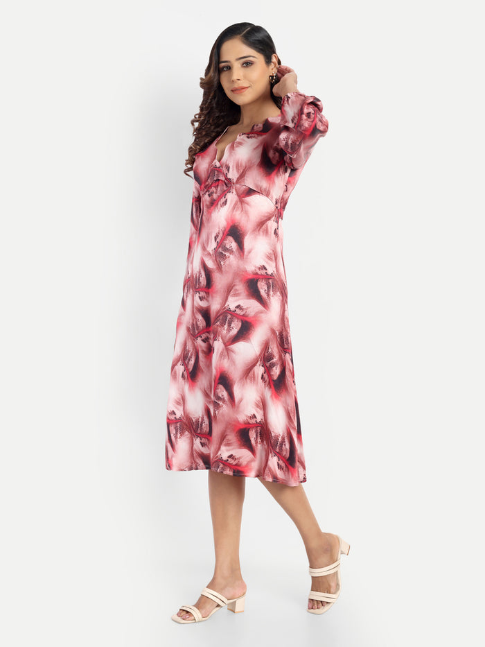 Women’s red printed Dezi midi dress with long sleeves and elegant relaxed fit