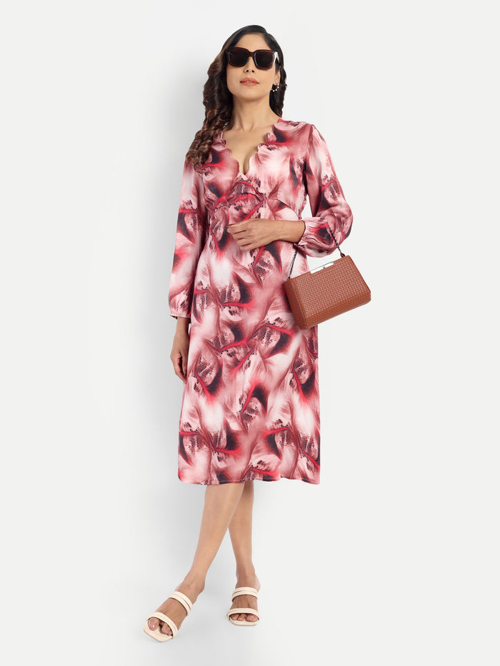 Women’s red printed Dezi midi dress with long sleeves and elegant relaxed fit