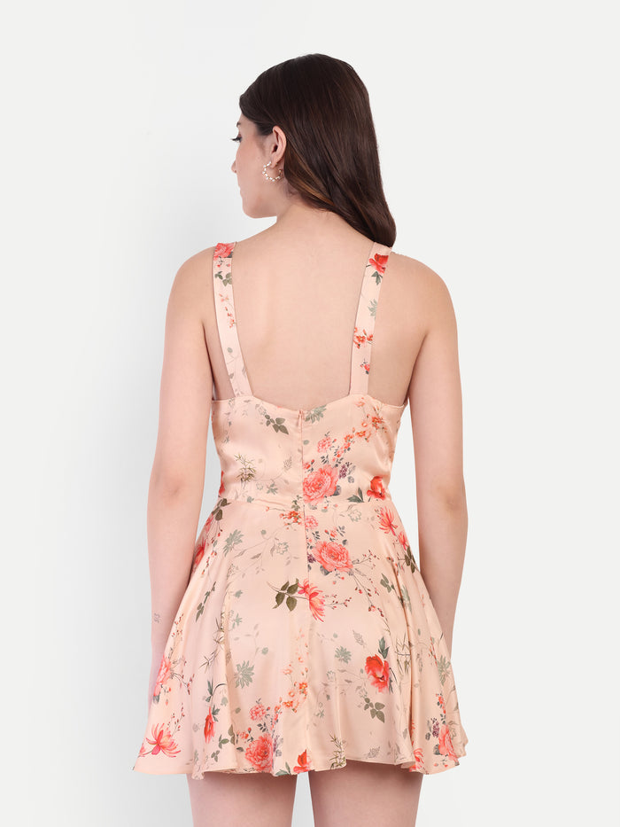 Women’s peach floral Kazo mini dress with sleeveless design and flared fit
