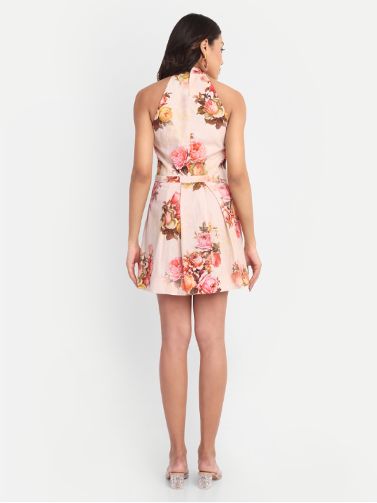 Women’s peach floral Lili mini dress with halter neck and flared silhouette