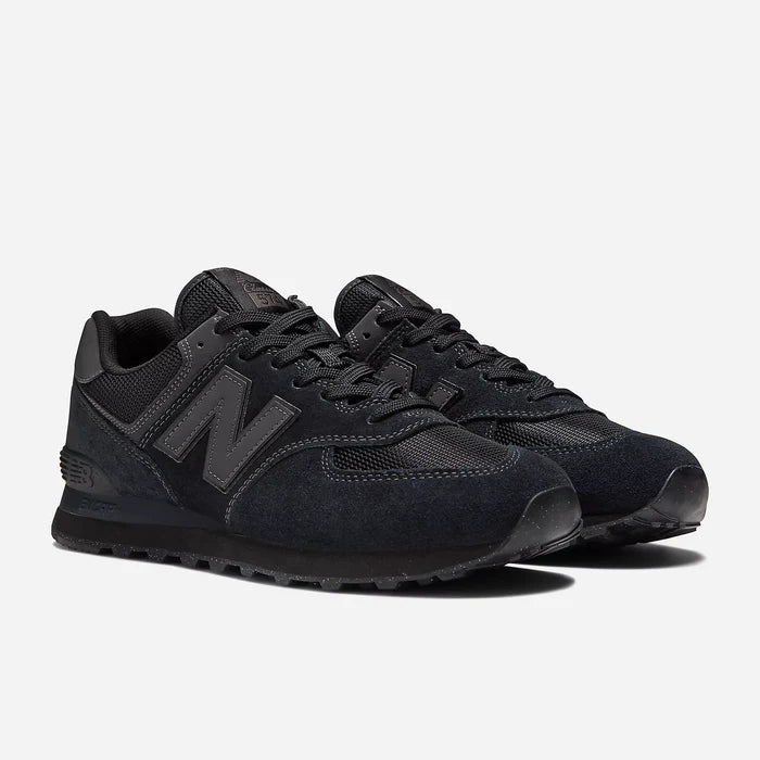 Black New Balance sneakers on a white background