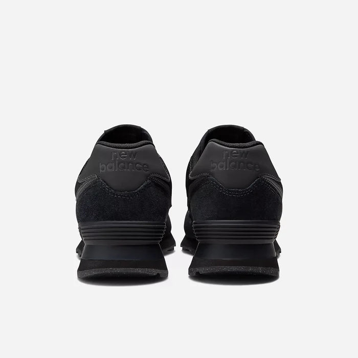 Black New Balance sneakers shown from the back on a white background