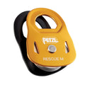 Yellow and black PETZL rescue pulley on a white background