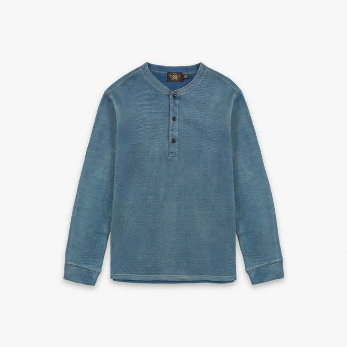 A blue long-sleeve henley shirt with a three-button placket, displayed flat against a light gray background.
