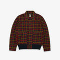 A plaid button-up jacket with a red, green, and yellow tartan pattern, featuring a dark navy ribbed collar, cuffs, and hem, displayed flat against a light gray background.