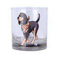 Clear rocks glass featuring a Bluetick Coonhound walking with an orange and white checkered bandana.